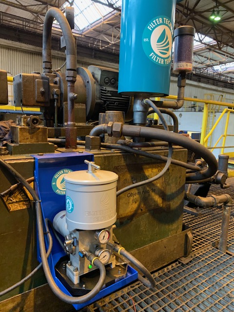 Filtertechnik filtration unit installed beside industrial machinery