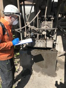 Technician collecting and inspecting a fluid sample
